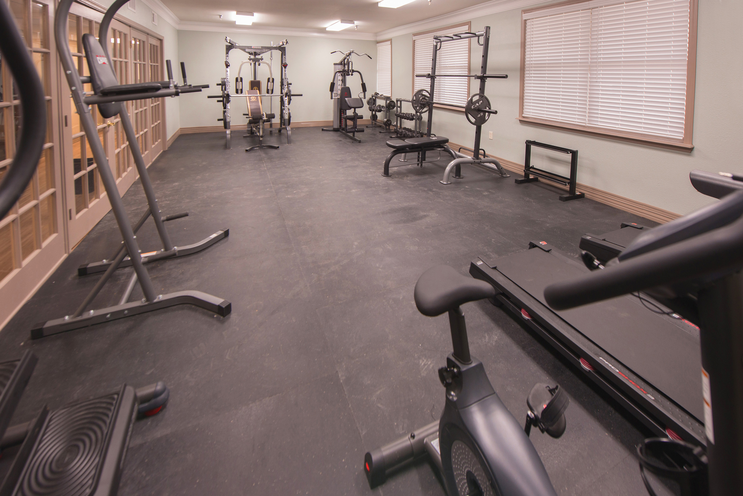 Fitness room with cardio and weight equipment