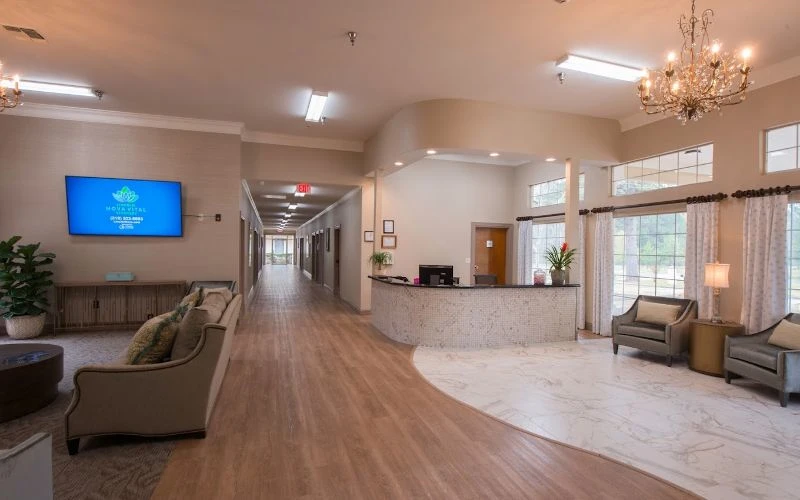 Spacious lobby with sofas and a reception counter