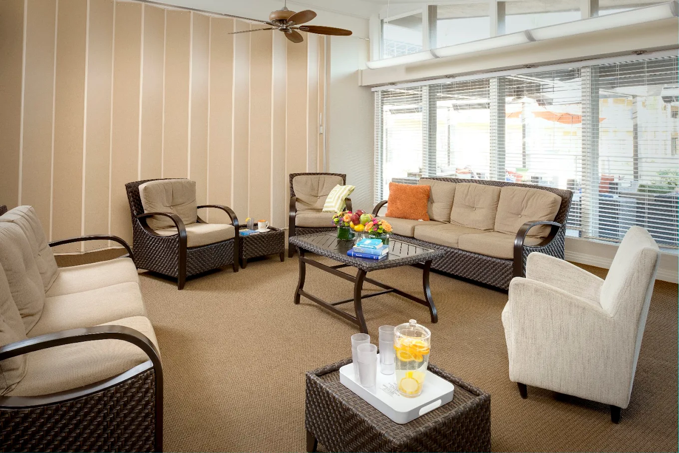 Cozy seating area with wicker sofas and soft lighting