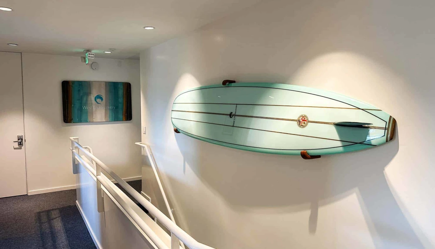 Longboard mounted on the wall in hallway