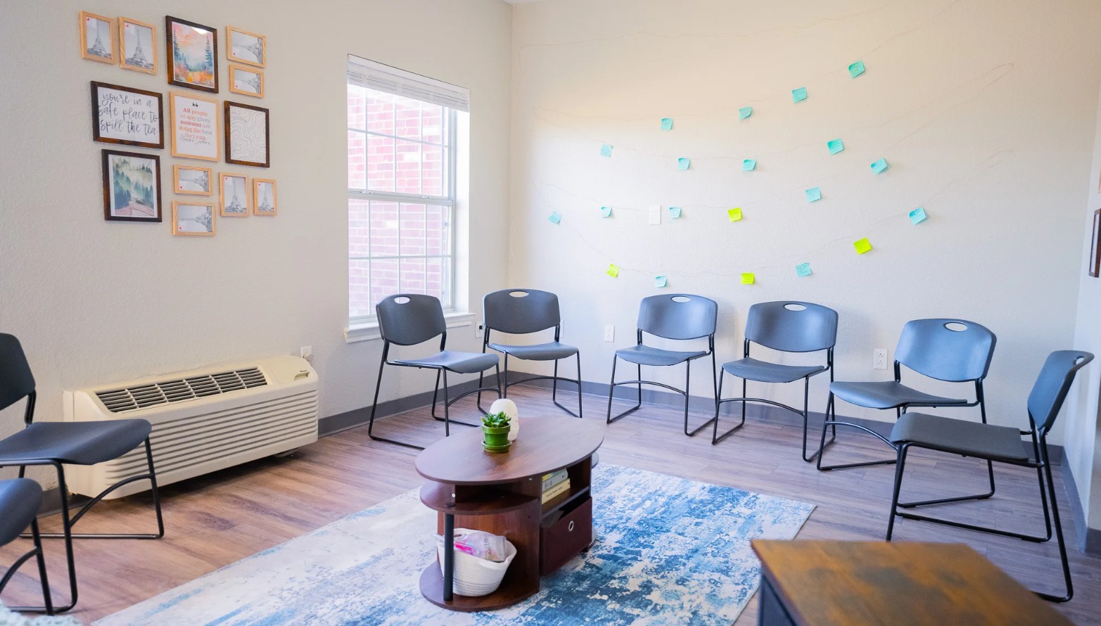 Comfortable group therapy room with circle seating designed for counseling and peer support sessions