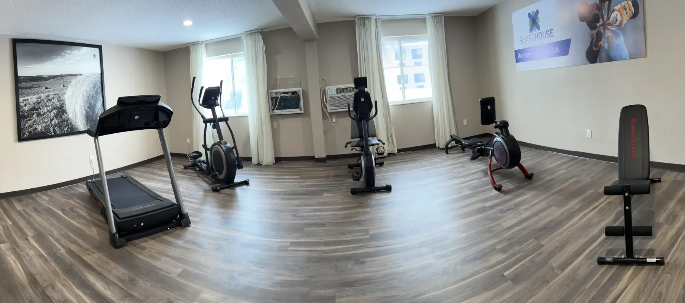 Fitness room with cardio machines and strength equipment