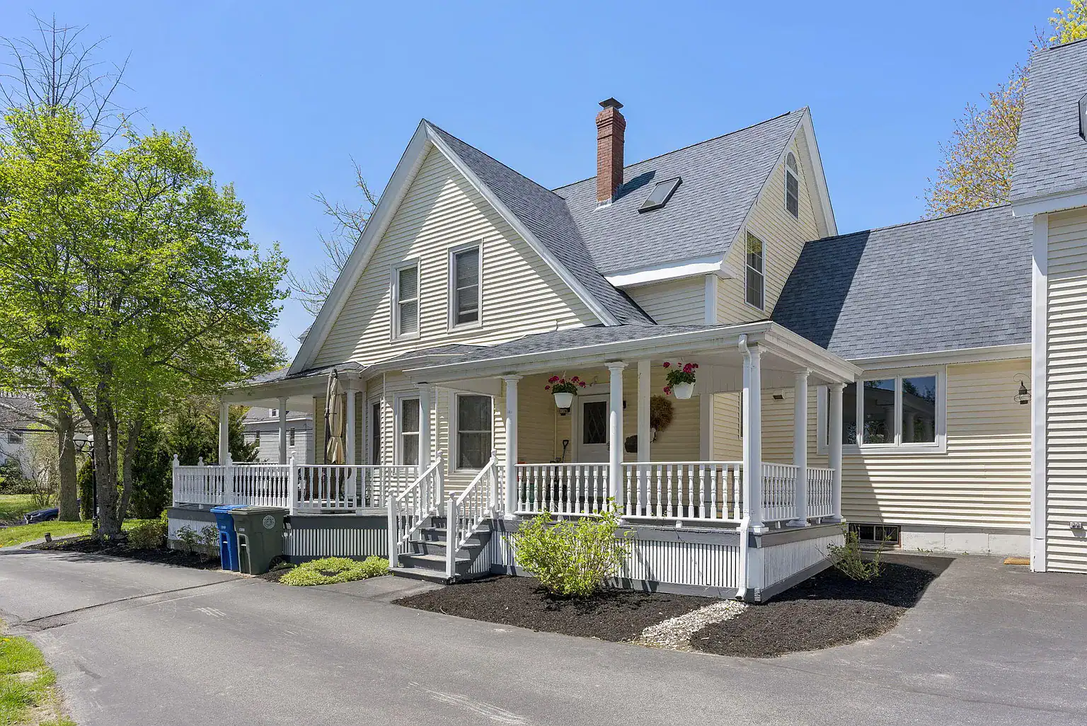 Restored farmhouse with wraparound porch on the Southern Maine Recovery residential campus