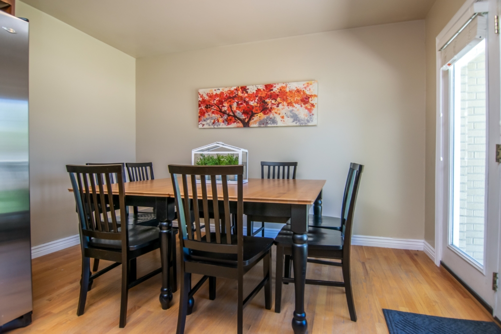Shared dining area with table and chairs for residents