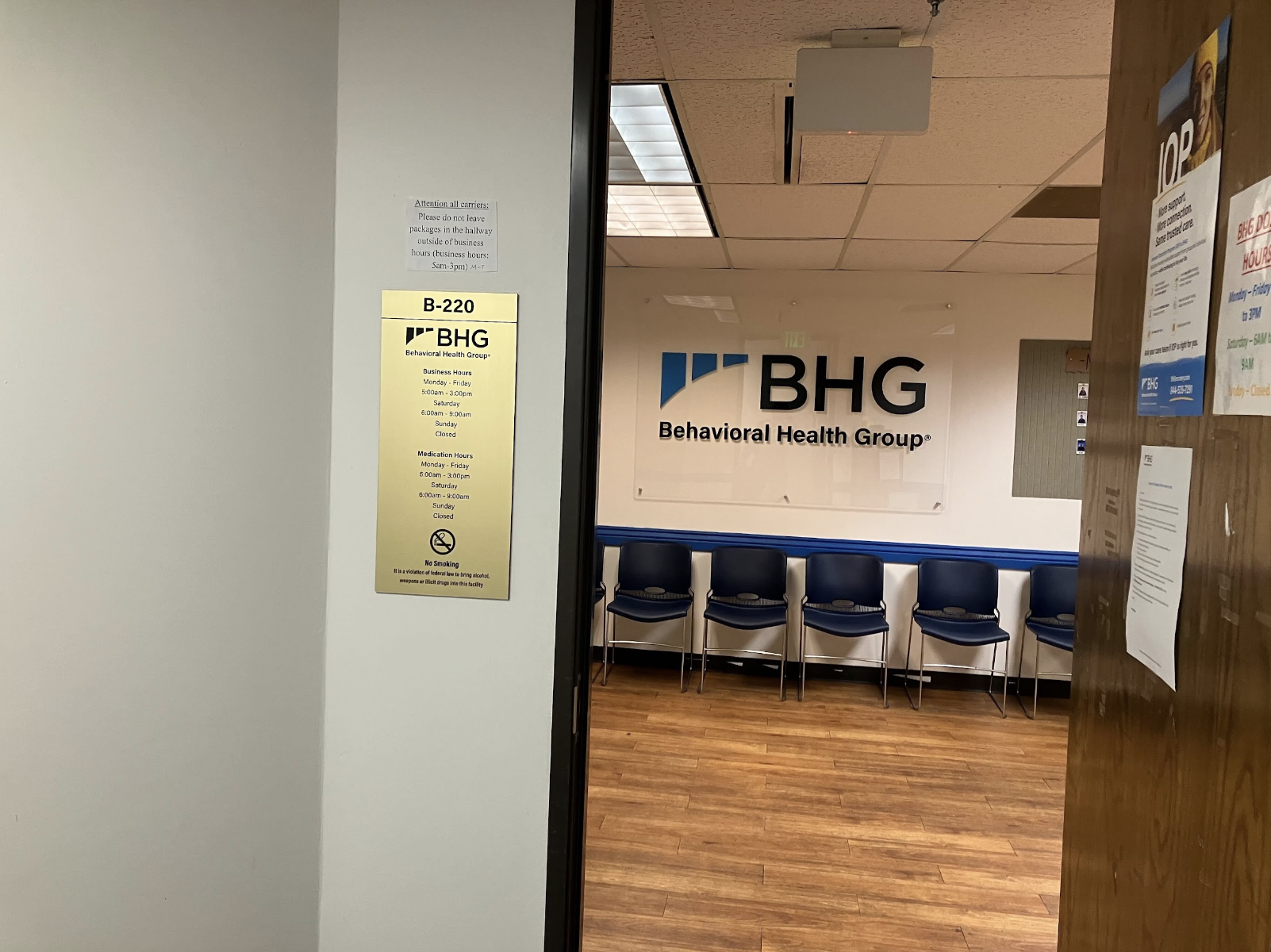 Lobby waiting area with seating and BHG wall sign
