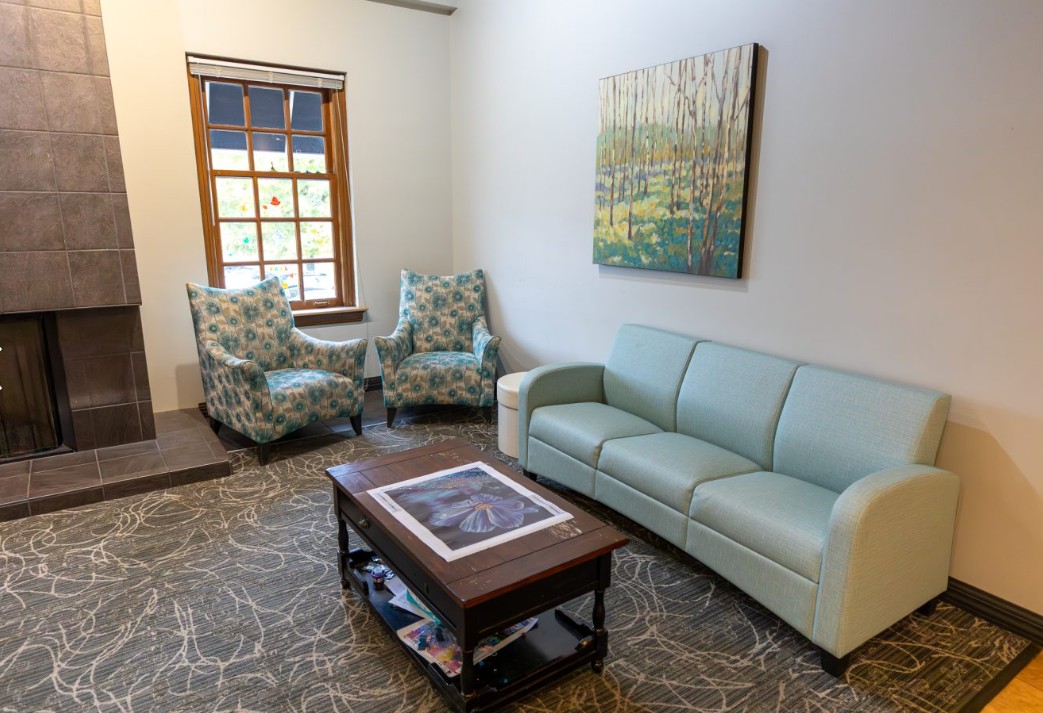 Living room with couch, chairs, and coffee table
