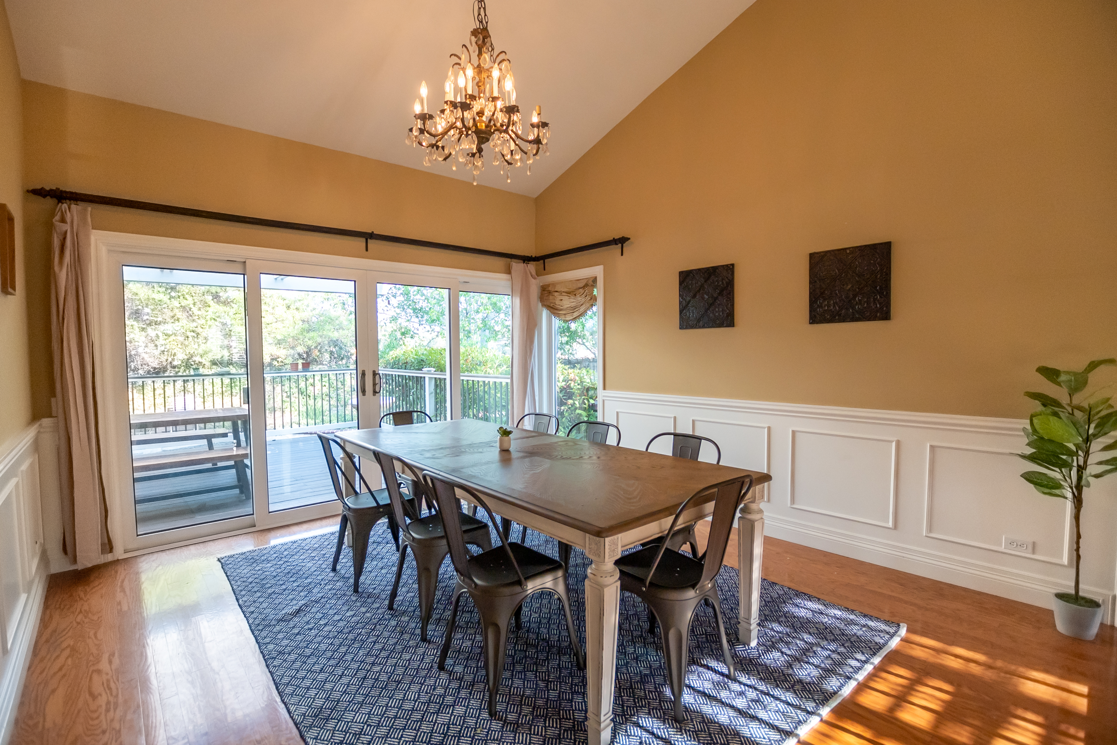 Dining room table next to large glass doors