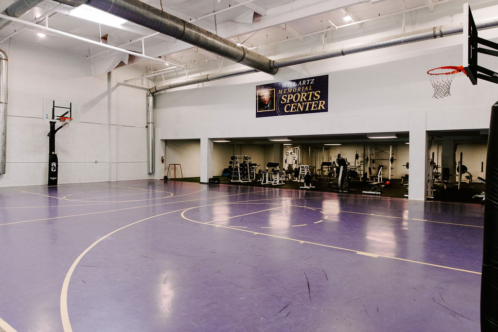 Indoor gym with basketball court and fitness area
