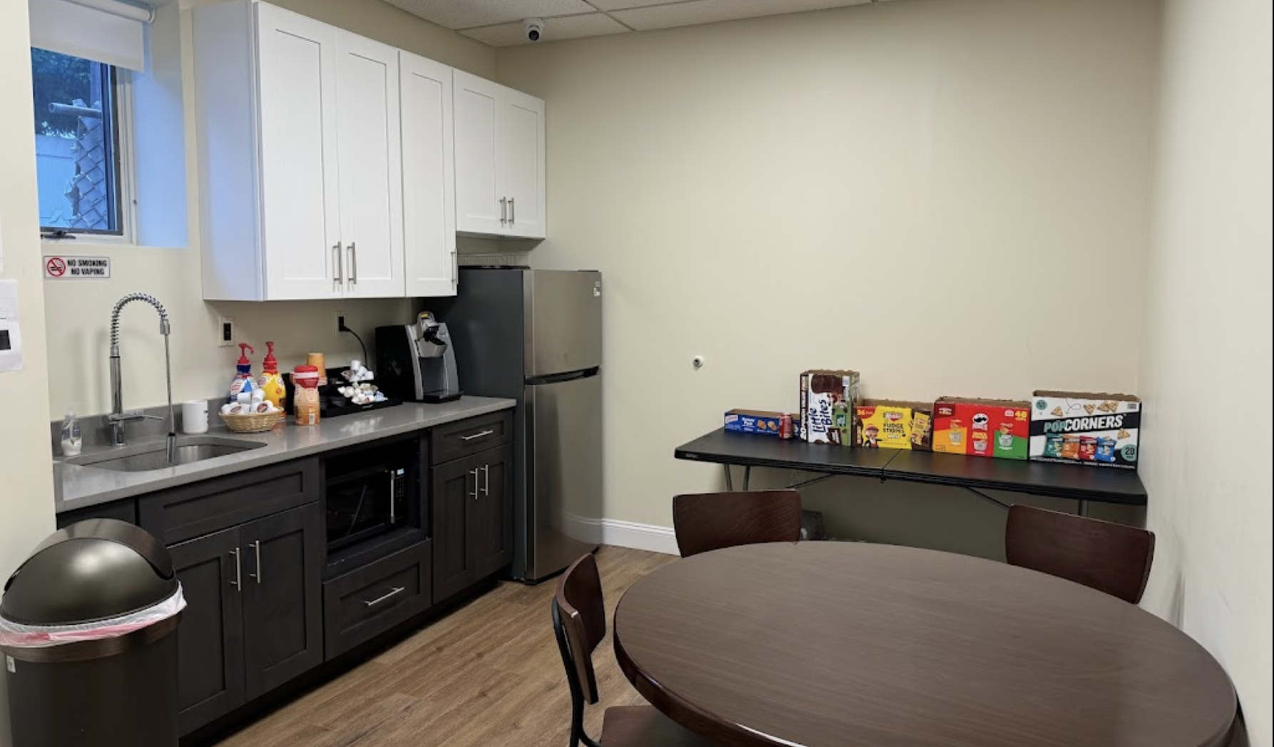 Break room with kitchenette and snack table
