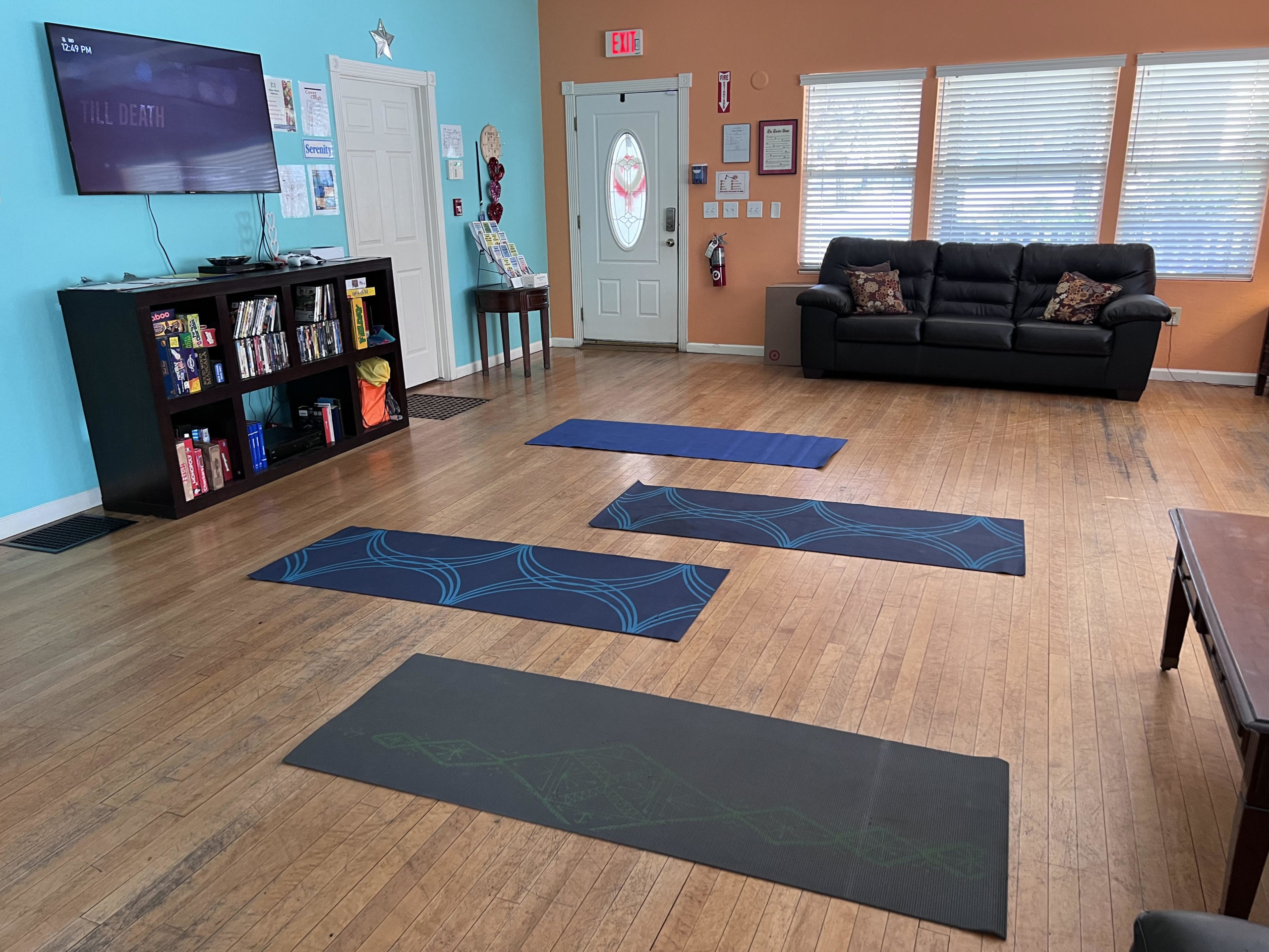 Yoga mats laid out in a bright room with natural light