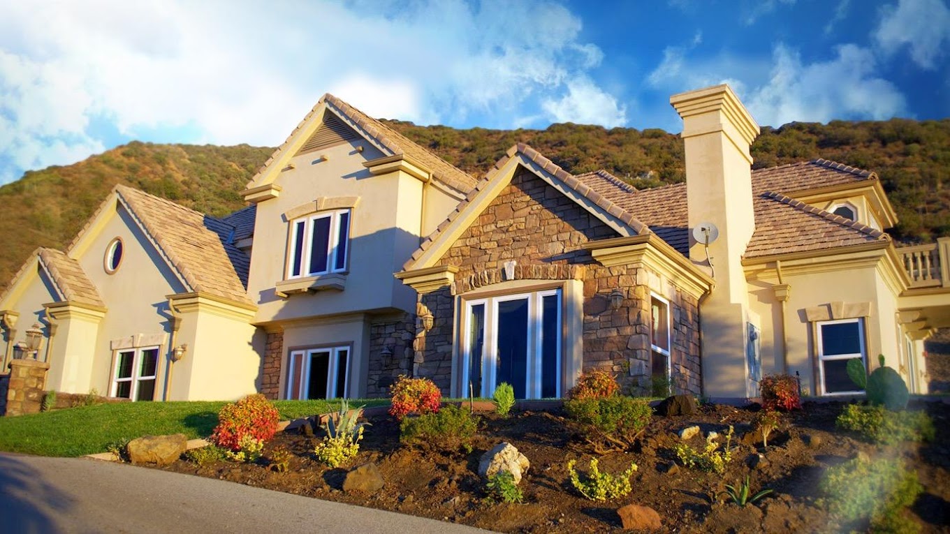 Large house with stone and stucco exterior