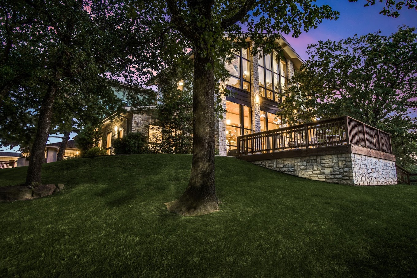 Rehab facility at night, surrounded by trees and soft lighting