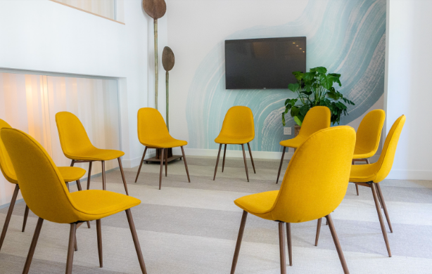 Group room with yellow chairs arranged in a circle