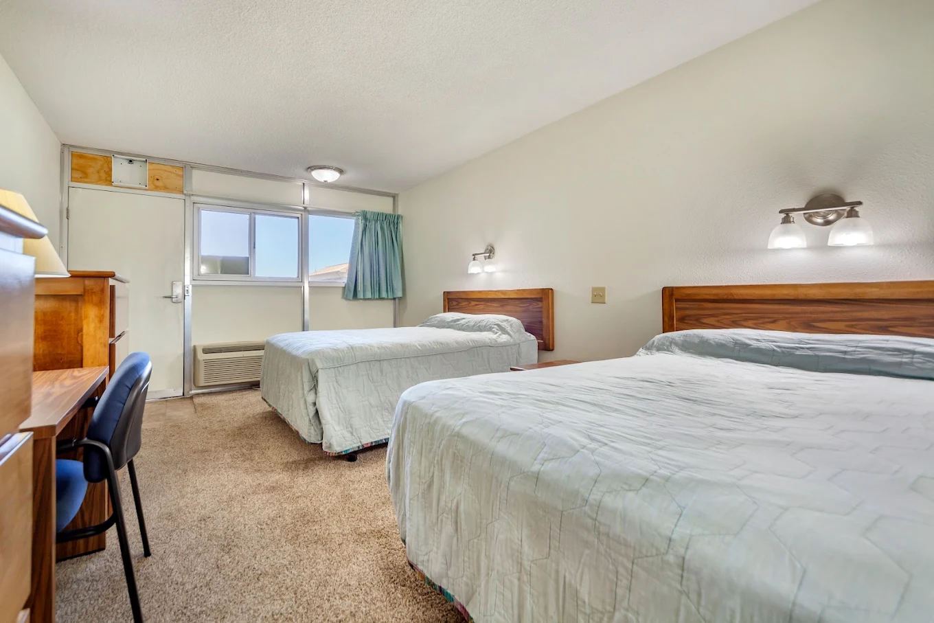 Shared bedroom with two beds and personal storage