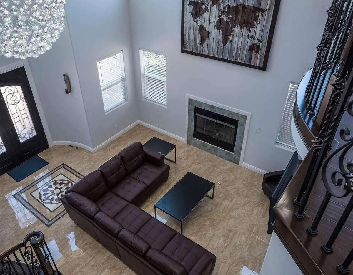 Living room with a sofa, and a fireplace.