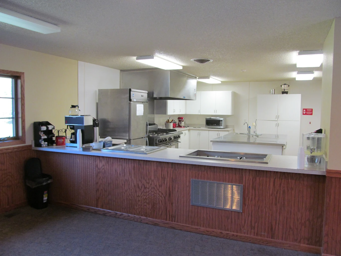 Community kitchen with appliances and food prep space