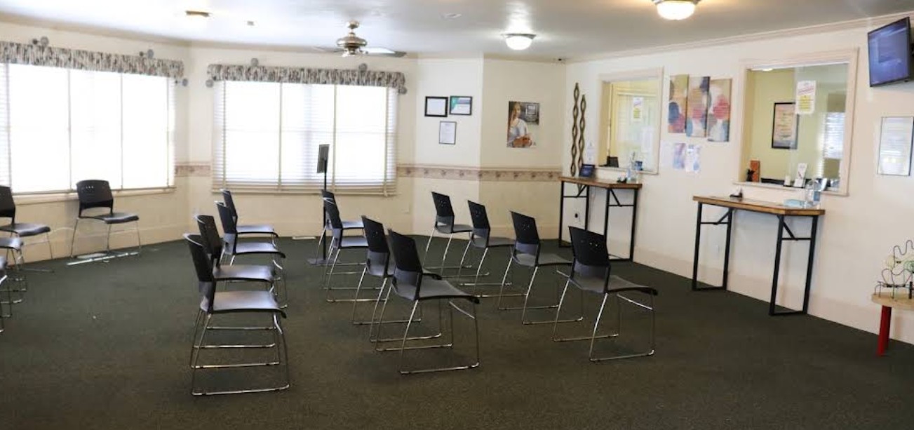 Group therapy room with arranged seating