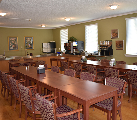 Dining room with wooden tables and chairs