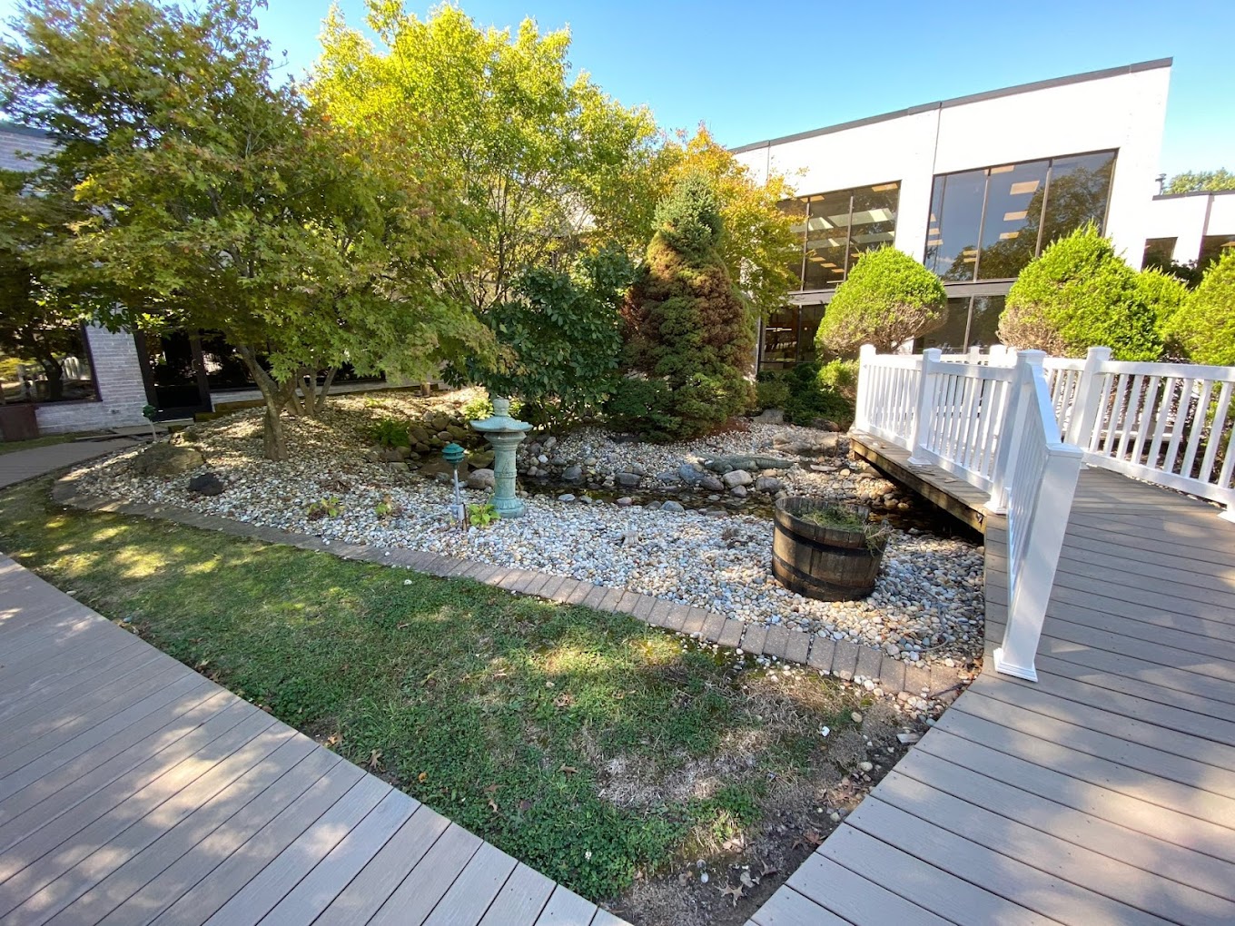 Garden area with a small stone-lined creek.
