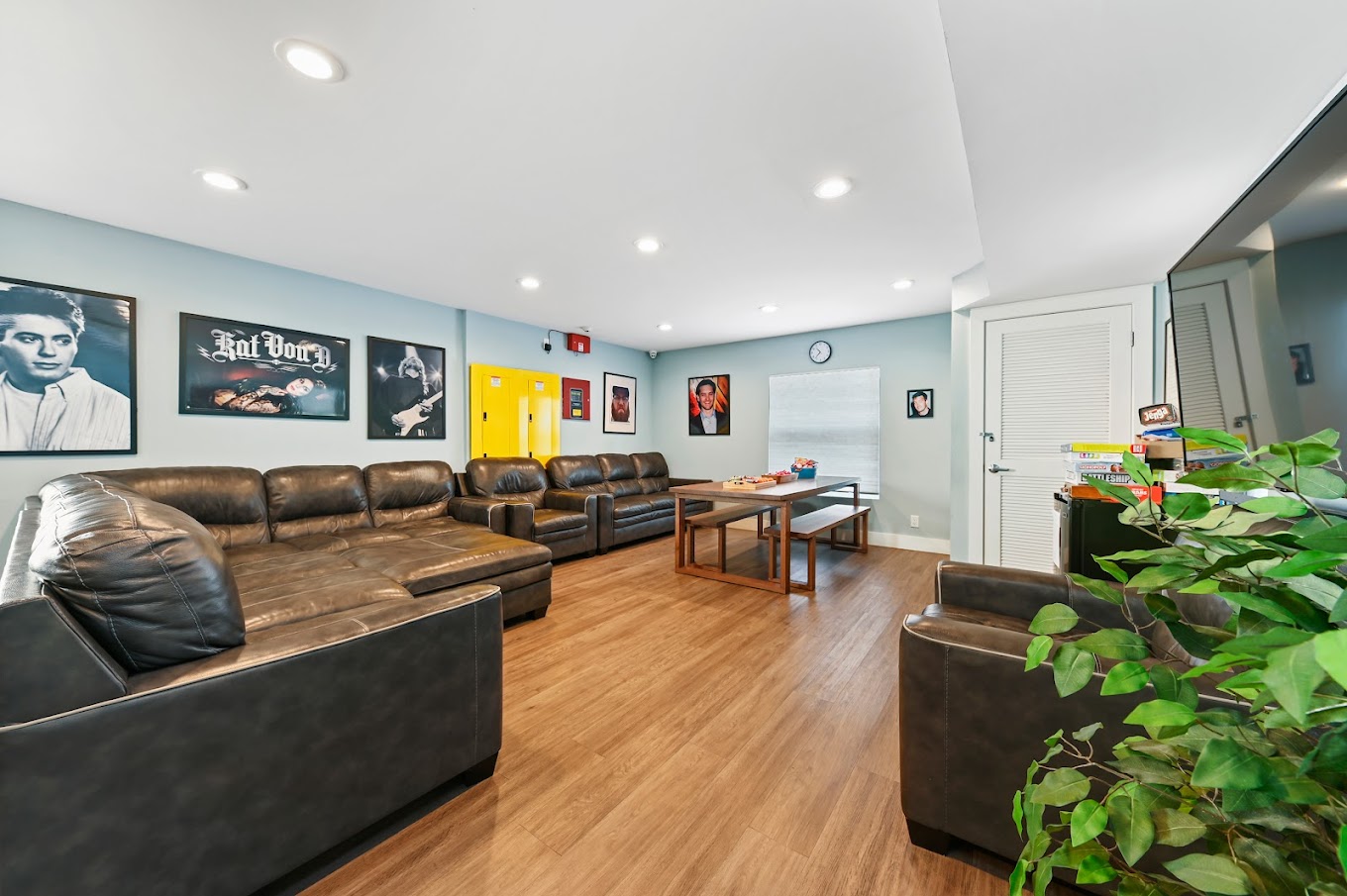 Lounge with seating, artwork, and a game table.