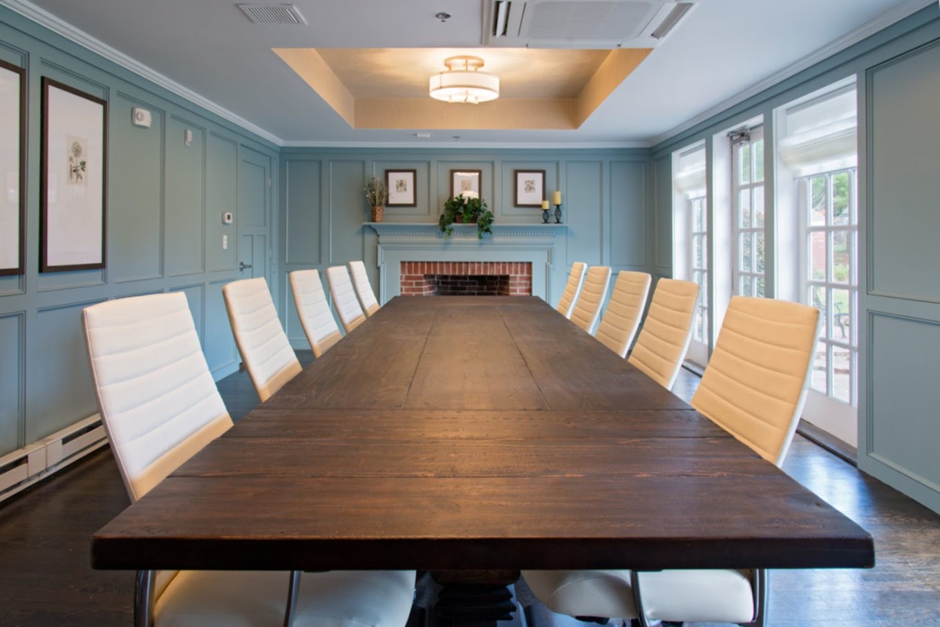 Conference room with a long table and chairs.