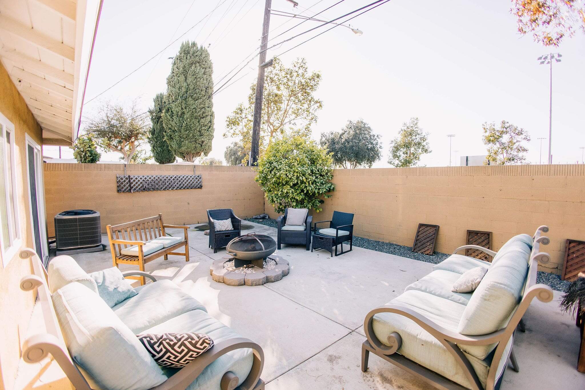 Outdoor seating area with sofas and fire pit