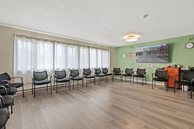 Group room with chairs arranged along walls