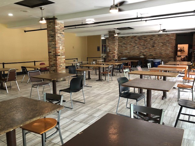 Spacious dining hall with tables and chairs