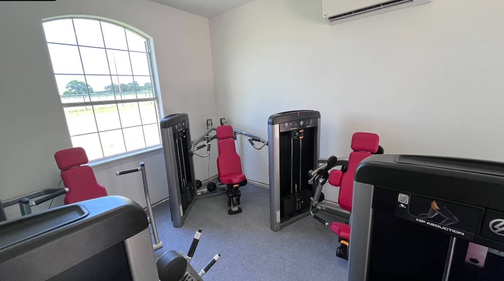 Fitness center with exercise machines and natural light