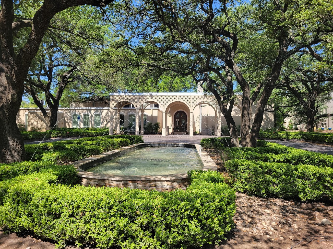 A landscaped courtyard with a water fountain.