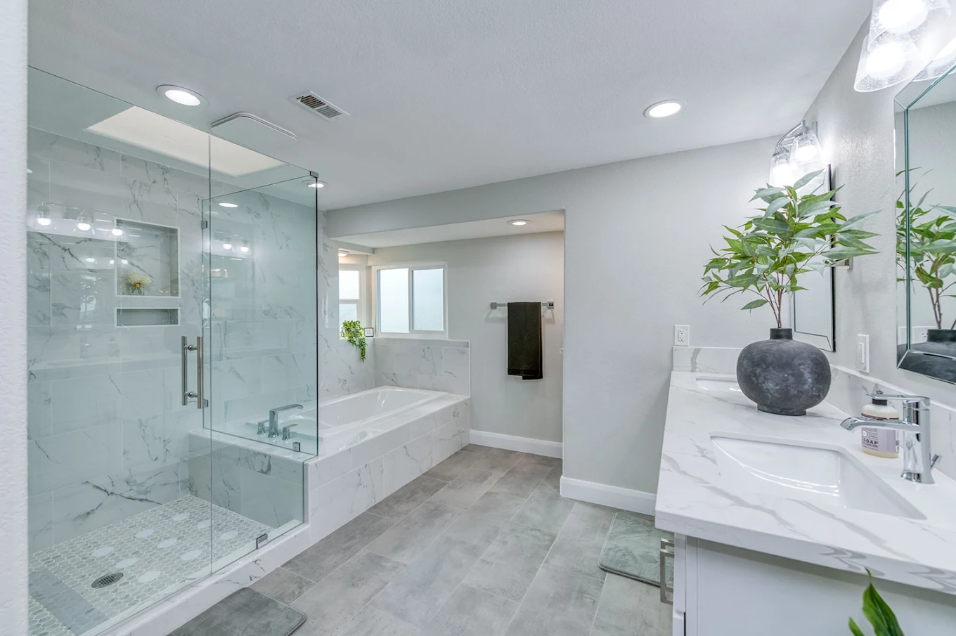 Spacious bathroom with glass shower and soaking tub