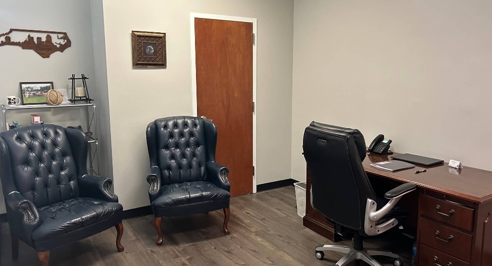 Therapy office with desk and comfortable seating