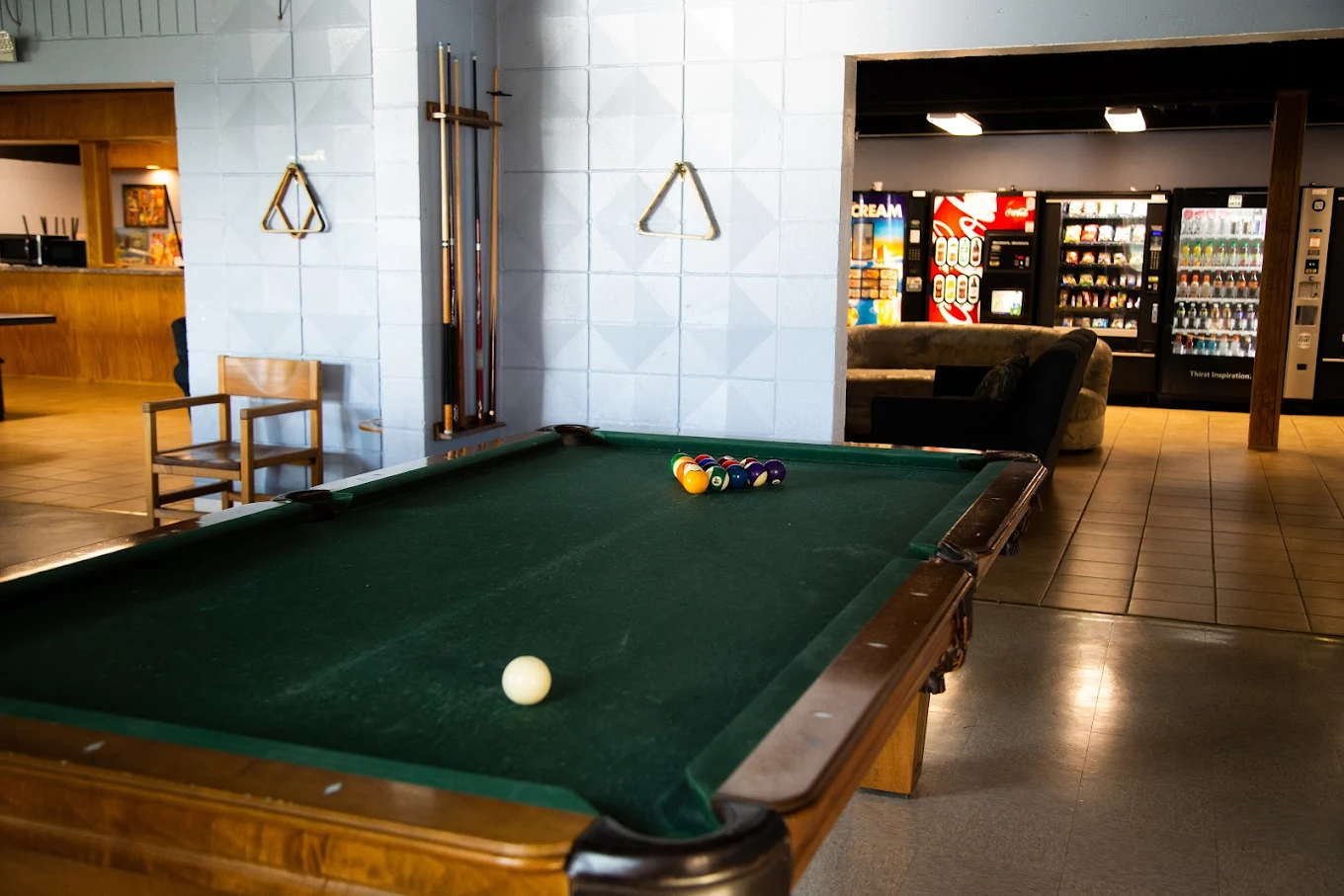 Pool table and vending machines in open rec space