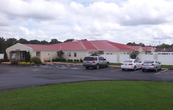 Front view of Buffalo Valley facility with red roof and parking lot.