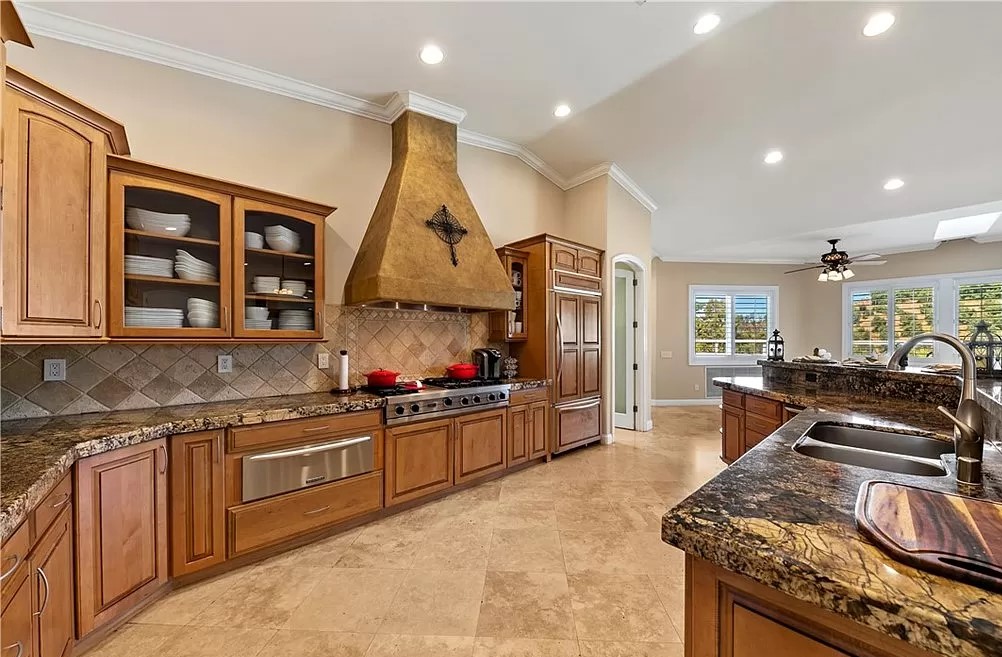 Kitchen with countertops, and a stove