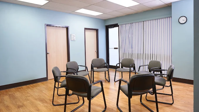 Circle of chairs for therapy in blue room
