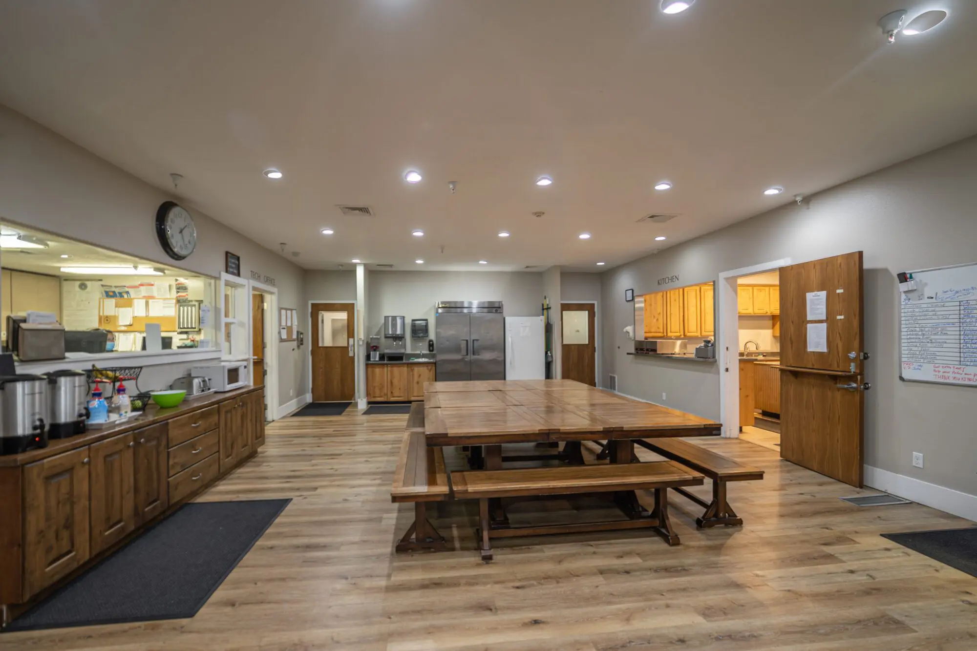 Communal dining room with large tables for shared meals