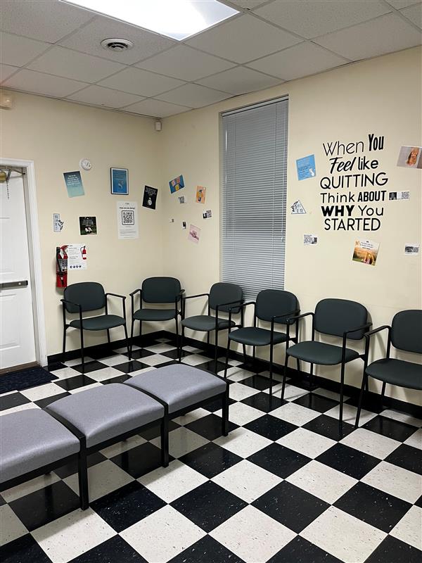 Waiting room with seating and motivational wall messages