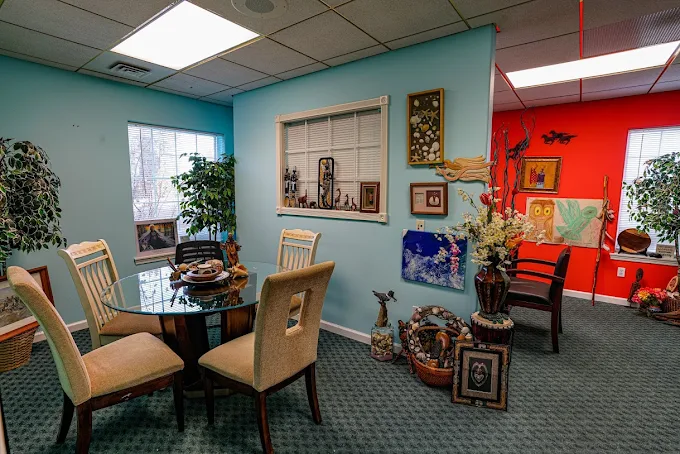 Colorful dining room with artwork and plants