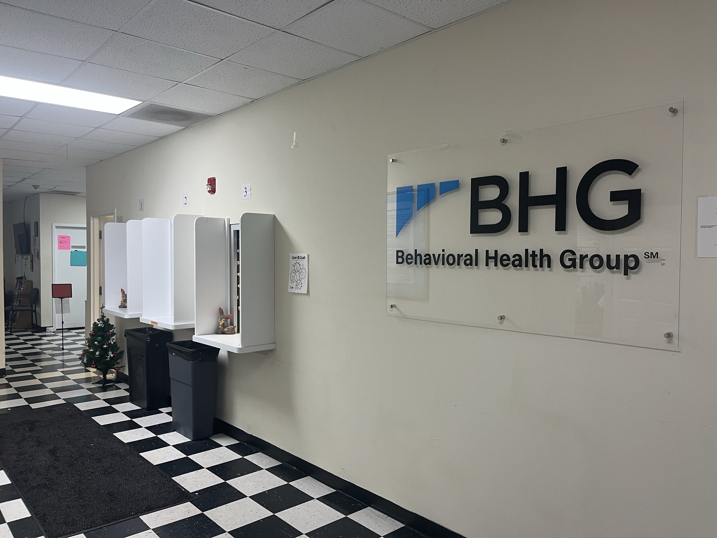 Patient service windows and BHG sign inside the clinic