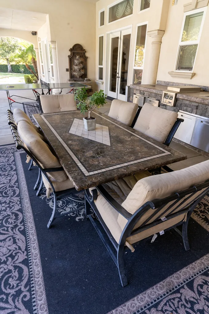 Covered patio with cushioned dining set