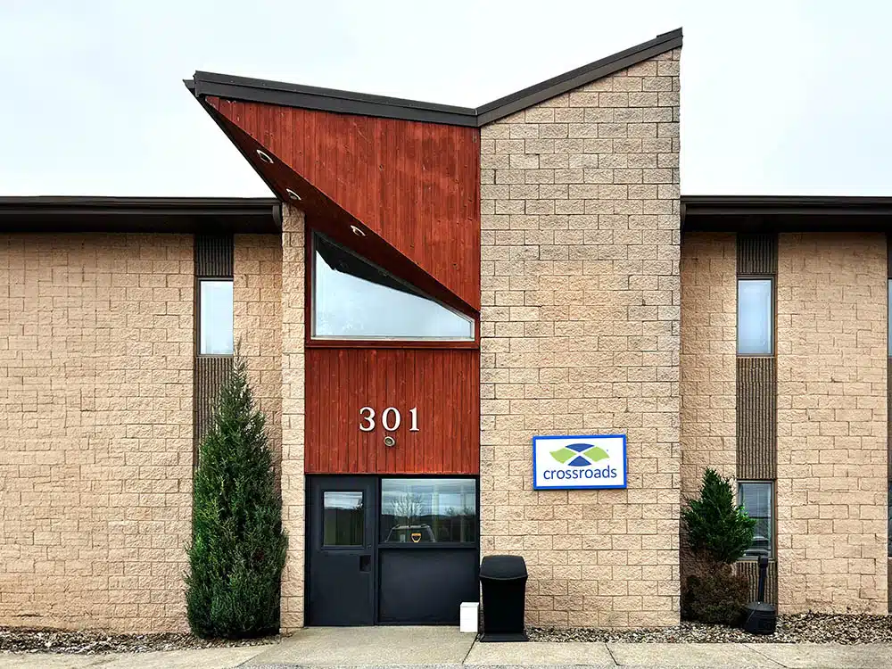 Building entrance with 301 number and Crossroads sign