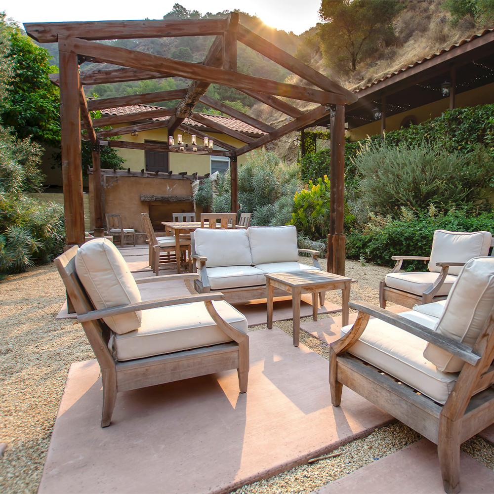 Courtyard with seating and a pergola.