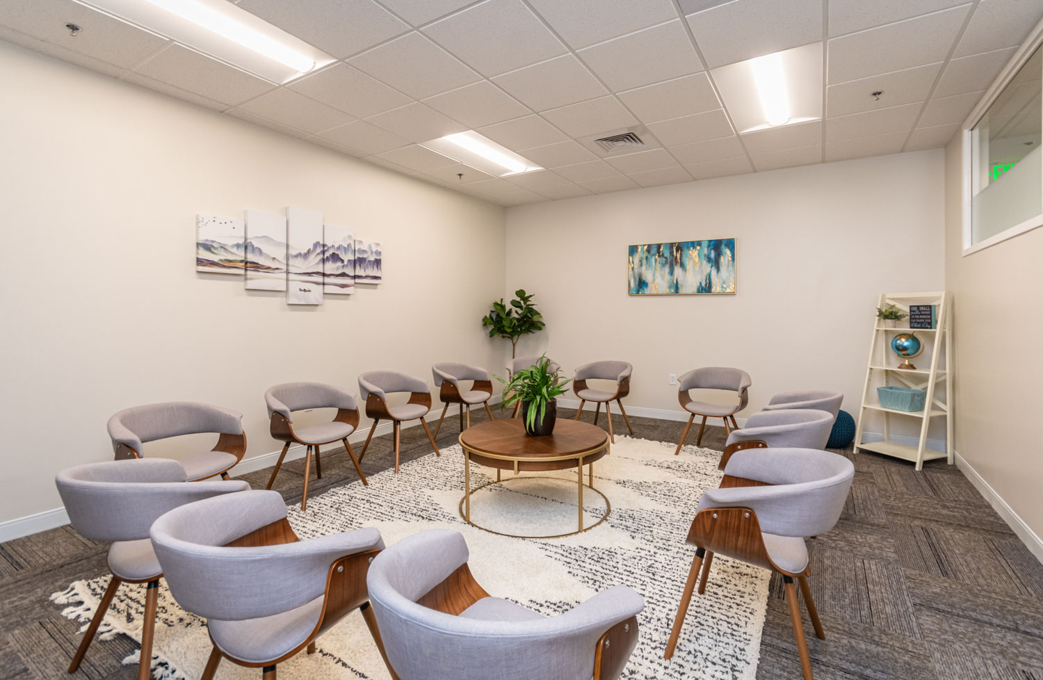 Group therapy room with chairs arranged in a circle.