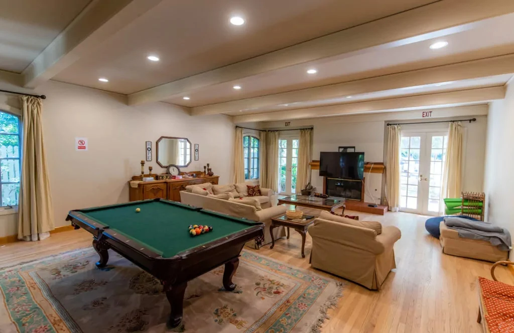 Game room with pool table and seating area