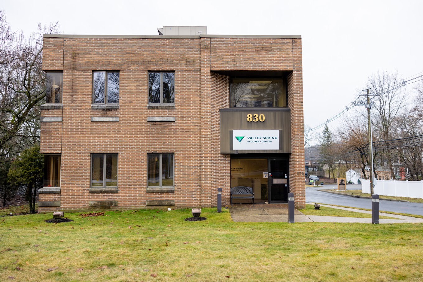 Facility exterior with signage at entrance.