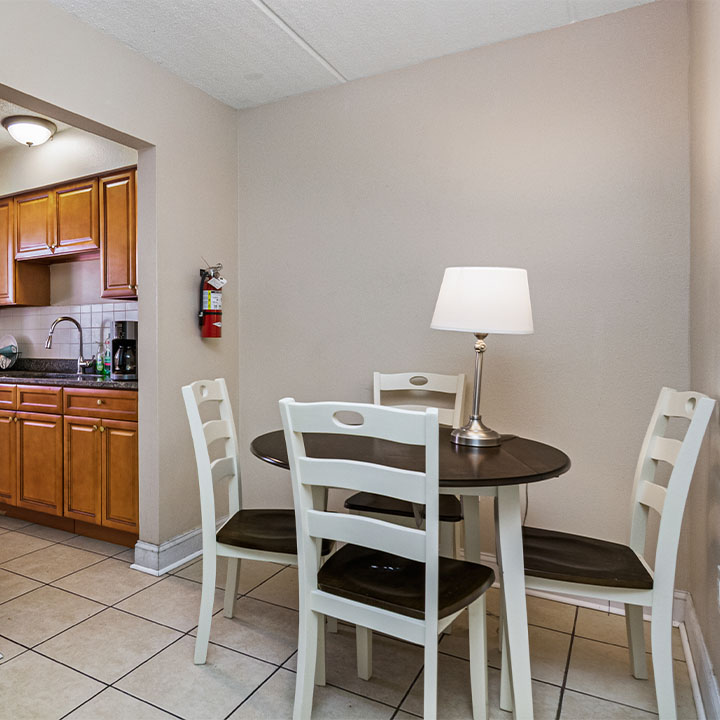 Dining area with chairs at a table.