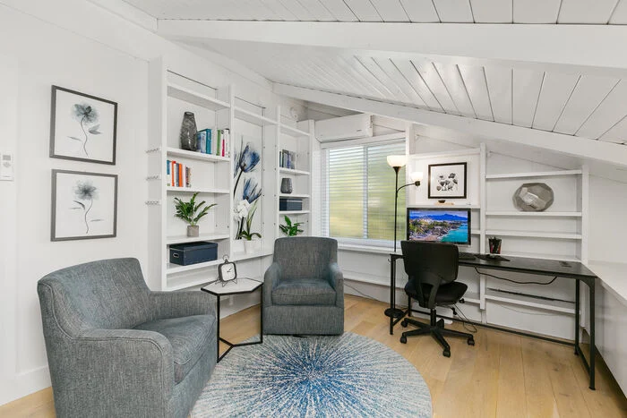 Quiet office with desk, bookshelves, and comfortable seating