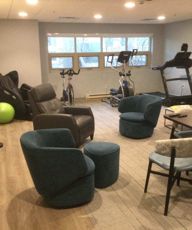 Exercise bikes and chairs in small therapy gym