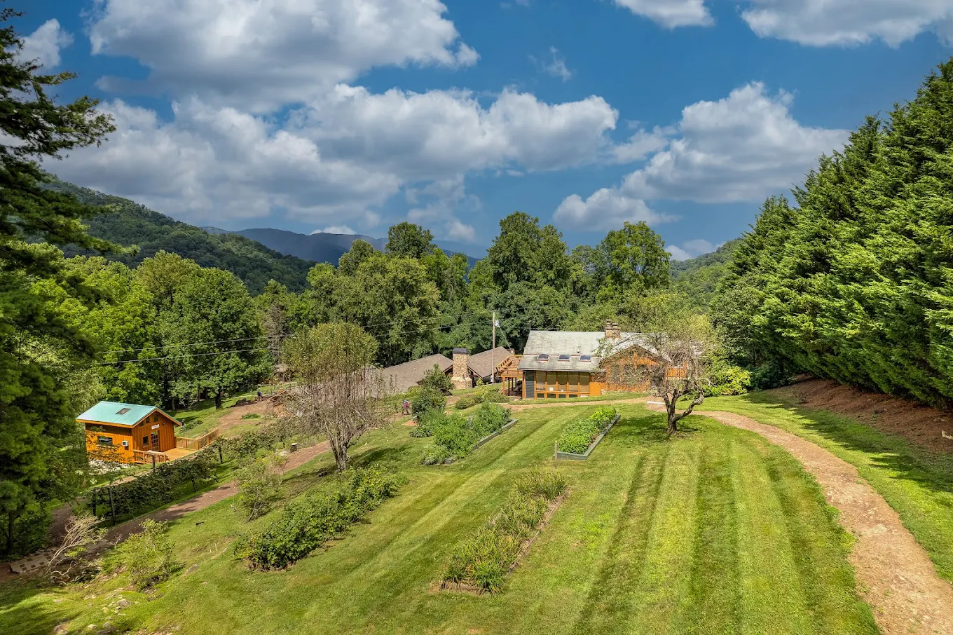 Wide view of landscaped grounds and buildings in mountain setting